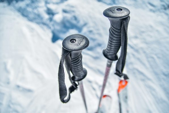 A detailed close-up view of the adjustable features on a pair of carbon trekking poles. The poles are shown in a natural outdoor setting with soft, diffuse lighting illuminating the metal and carbon fiber construction. The focus is on the locking mechanisms, tension adjustments, and other key details that allow the user to customize the pole length and grip. The image captures the technical sophistication and versatility of modern trekking pole design in a clean, minimalist composition that showcases the core functionality. A detailed close-up view of the adjustable features on a pair of carbon trekking poles. The poles are shown in a natural outdoor setting with soft, diffuse lighting illuminating the metal and carbon fiber construction. The focus is on the locking mechanisms, tension adjustments, and other key details that allow the user to customize the pole length and grip. The image captures the technical sophistication and versatility of modern trekking pole design in a clean, minimalist composition that showcases the core functionality.