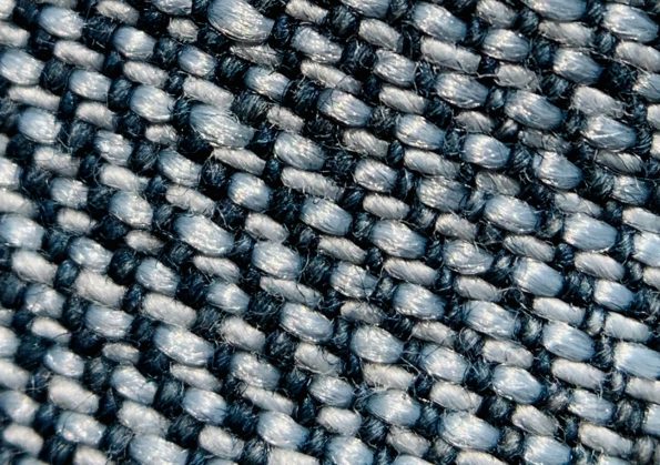 Close-up comparison of wear patterns on carbon fiber vs aluminum alloy hiking poles Close-up comparison of wear patterns on carbon fiber vs aluminum alloy hiking poles